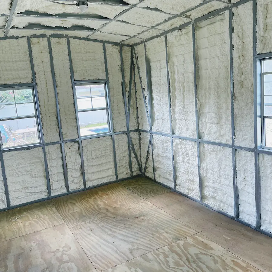 Closed-cell spray foam insulation applied to wall cavities in a residential project in Fairview